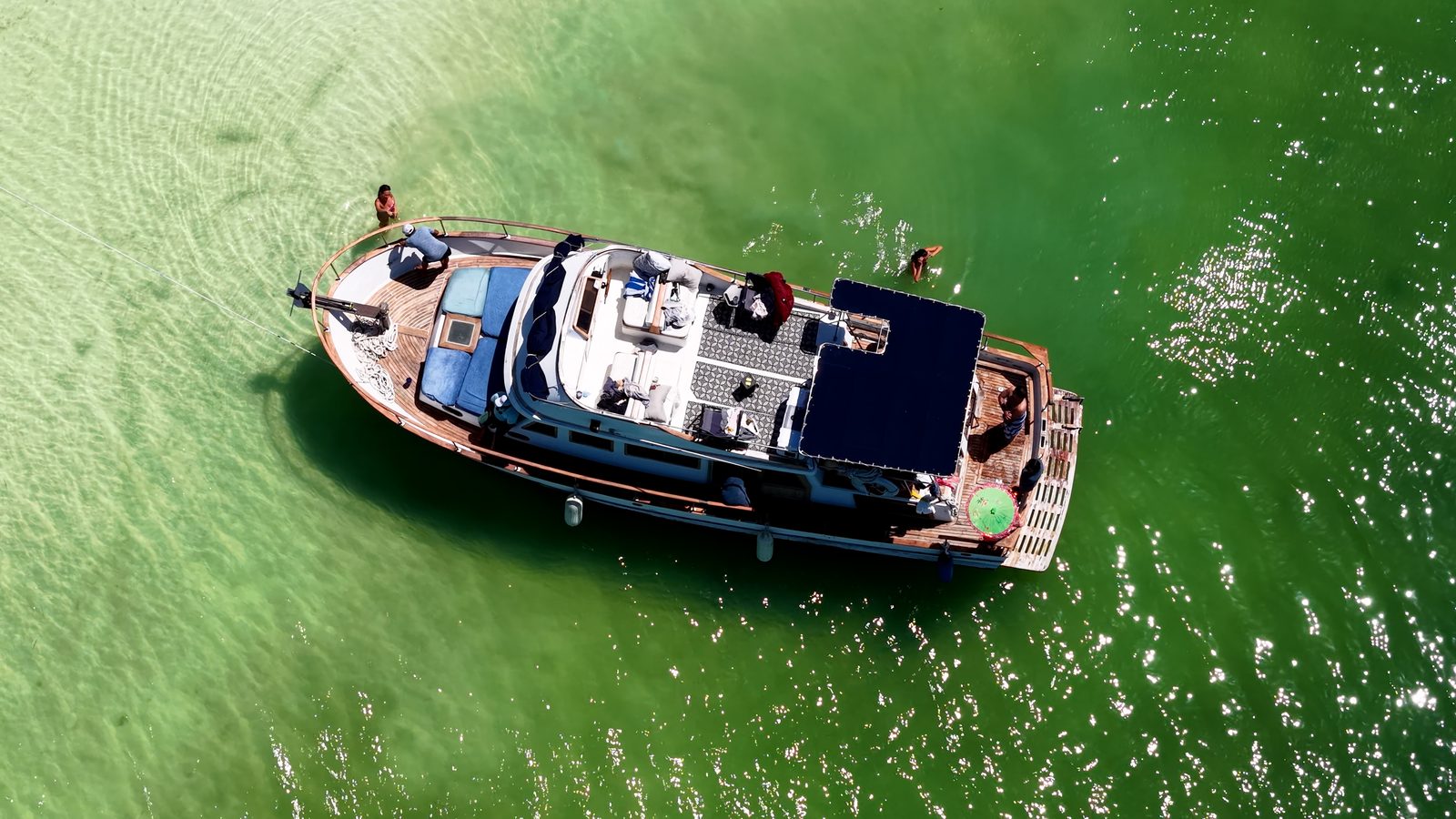 Top-down view of the Tafil with swimmers in clear shallow water