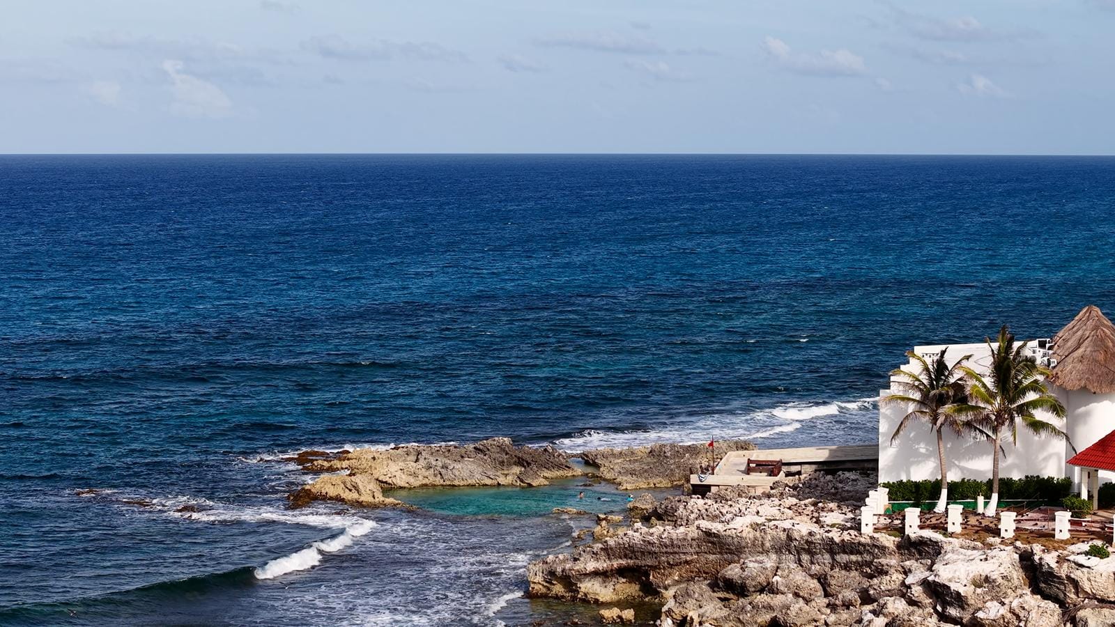 The rocky eastern shore of Isla Mujeres with deep blue Caribbean water