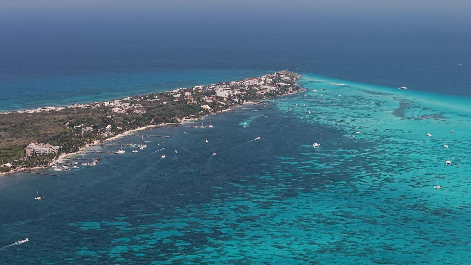 Aerial view of the southern tip of Isla Mujeres with turquoise water on both sides