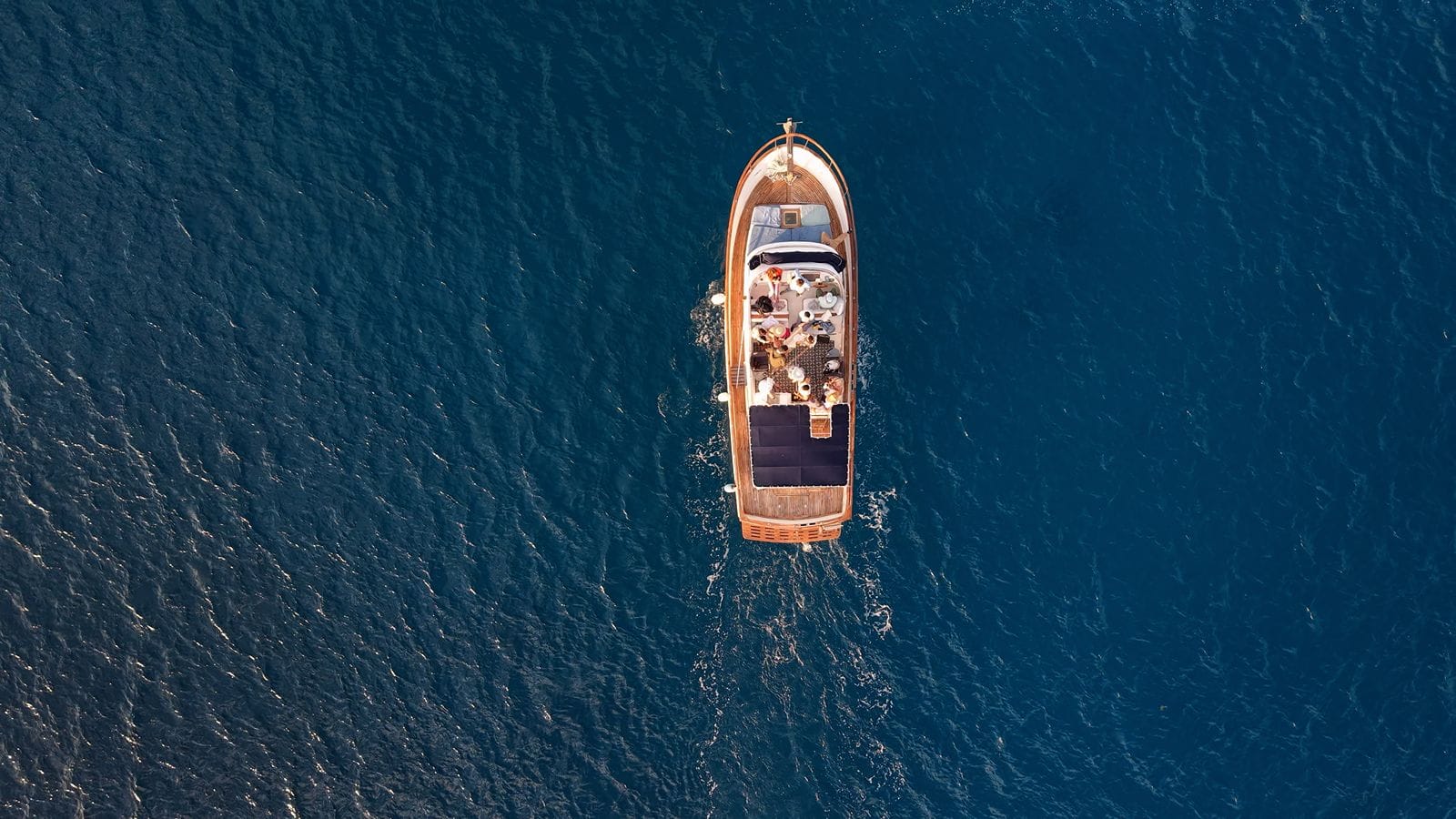 Top-down view of the Tafil cruising the deep blue Caribbean off the Hotel Zone