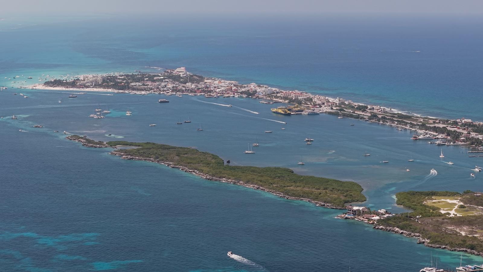 Aerial view along the length of Isla Mujeres with the lagoon in the middle