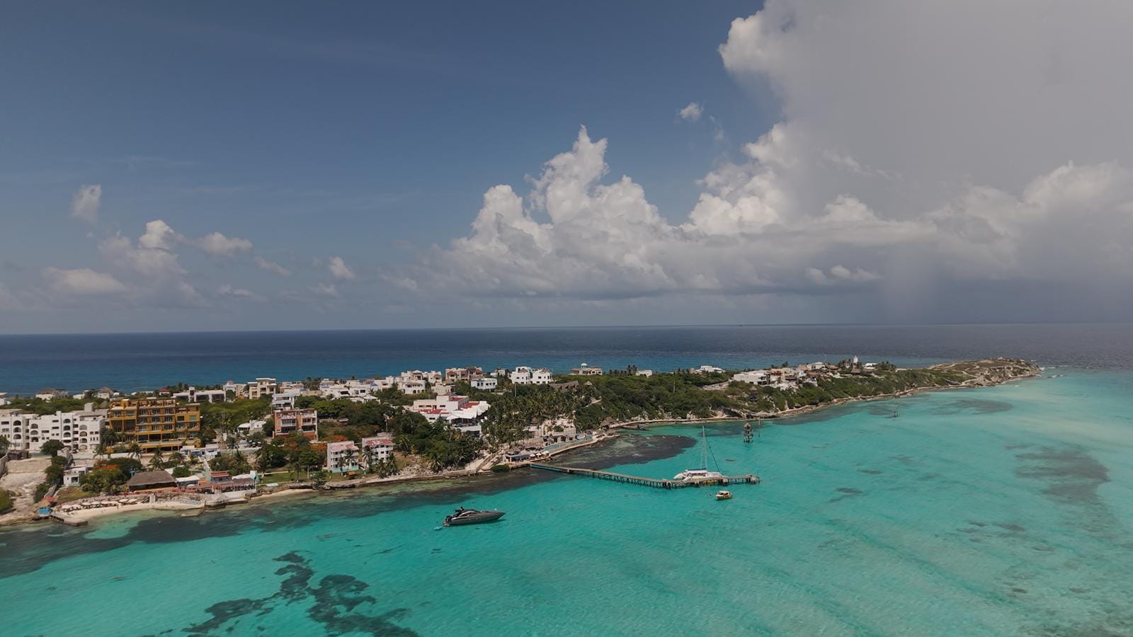 Aerial view of the Isla Mujeres coastline with the Caribbean stretching to the horizon