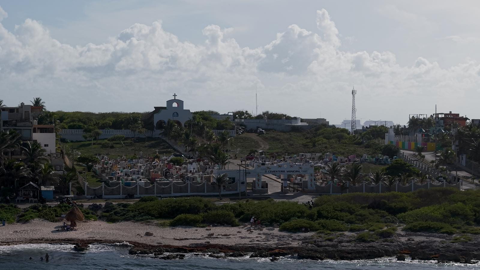 Palms and houses along the eastern shoreline of Isla Mujeres