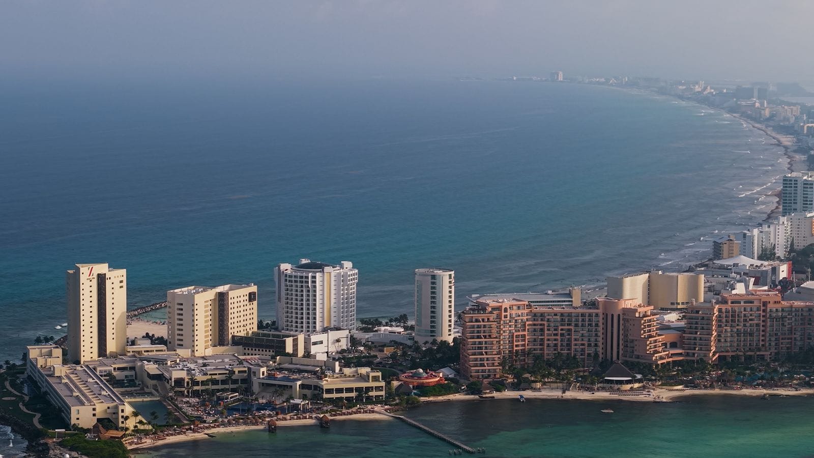 Aerial view of the Cancún Hotel Zone coastline and beaches from the sea