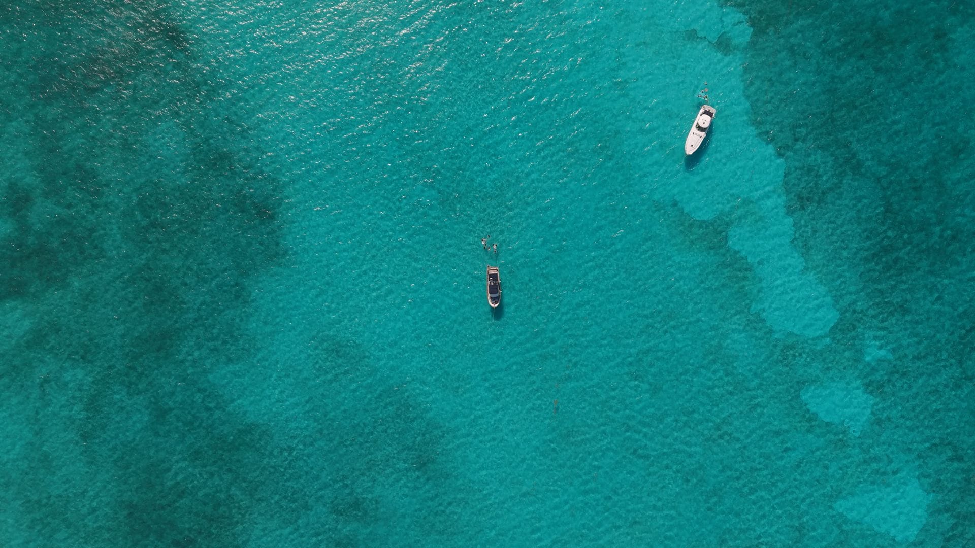 Aerial view of the white sandbanks of the Arenales under clear turquoise water