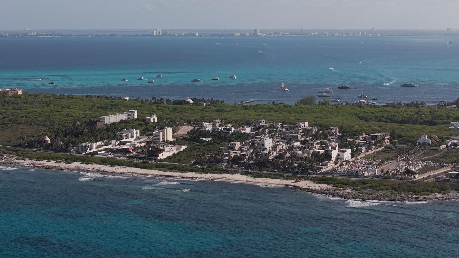 Wide view of the Isla Mujeres east coast and its low cliffs