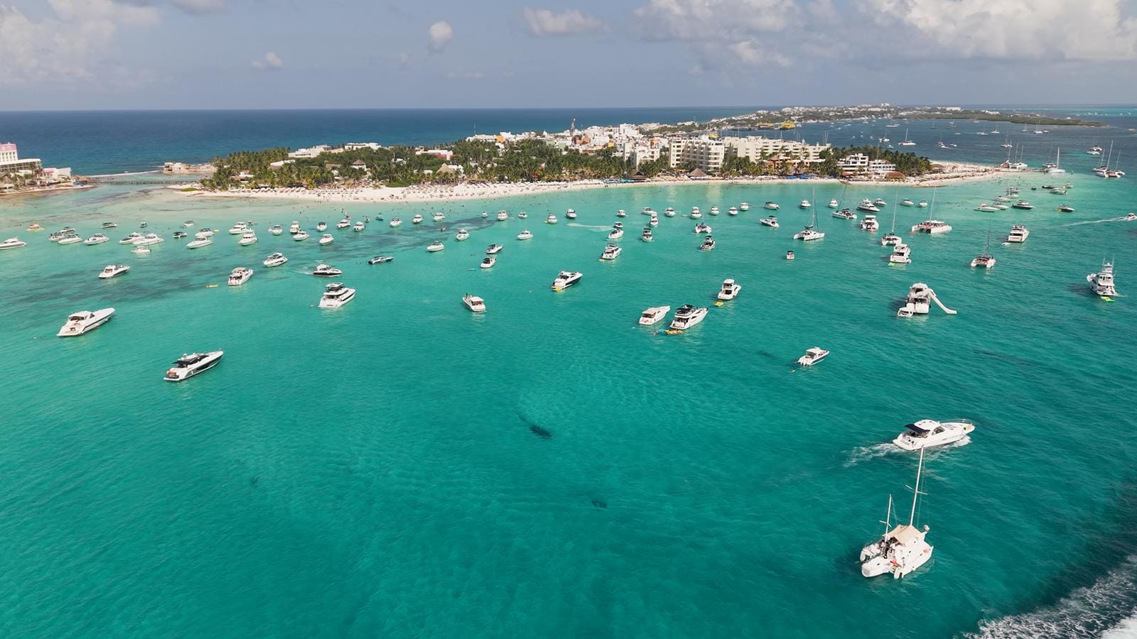 Aerial view of the northern tip of Isla Mujeres with boats anchored off Playa Norte