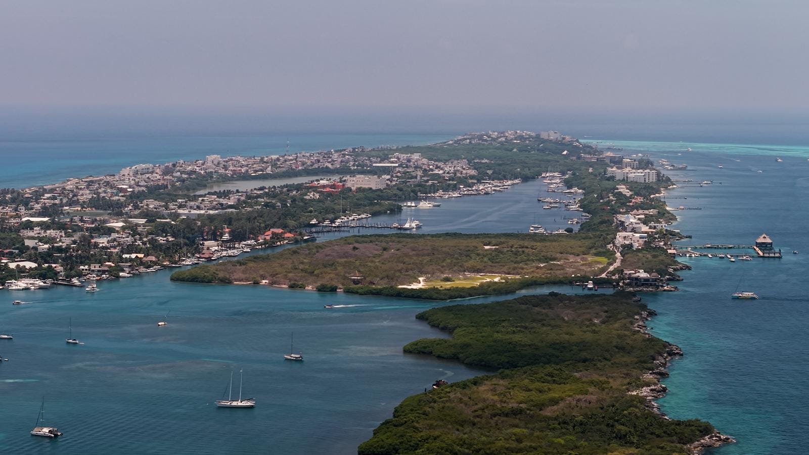 Aerial view of Isla Mujeres town and Laguna Macax from the south