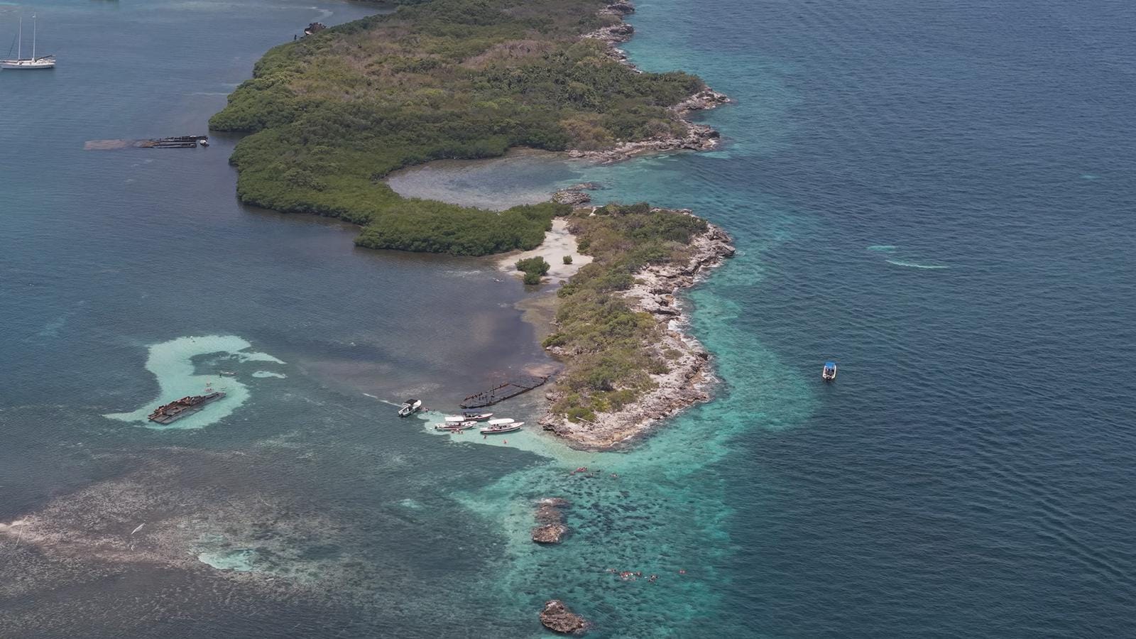 Aerial view of the mangrove islets and reef at the mouth of Laguna Macax