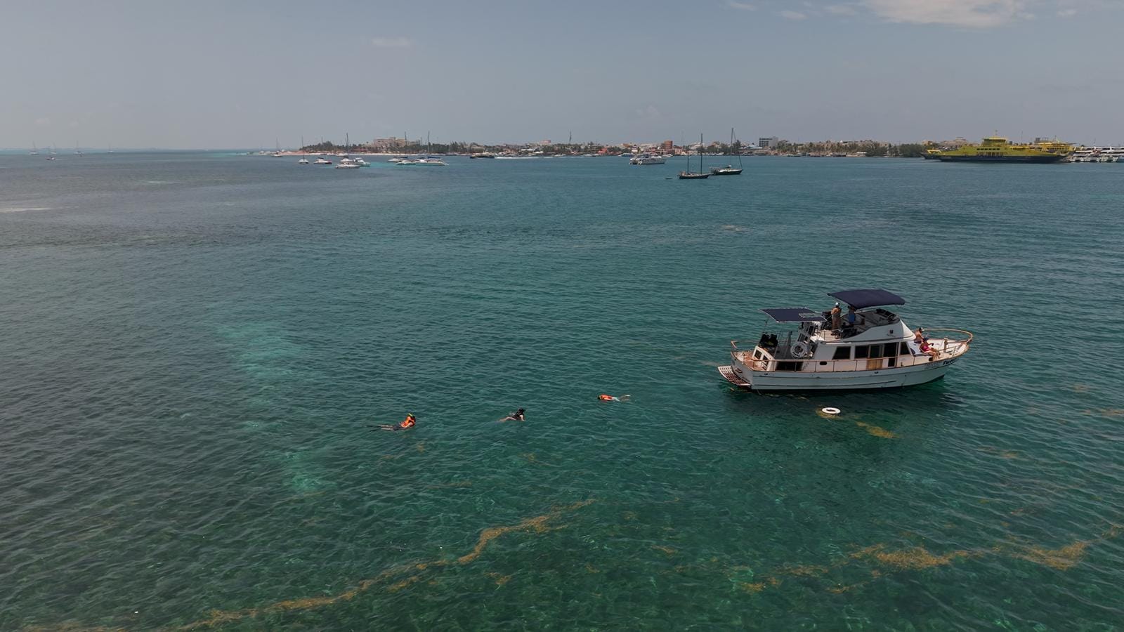 The Tafil anchored in the shallow water off Isla Mujeres