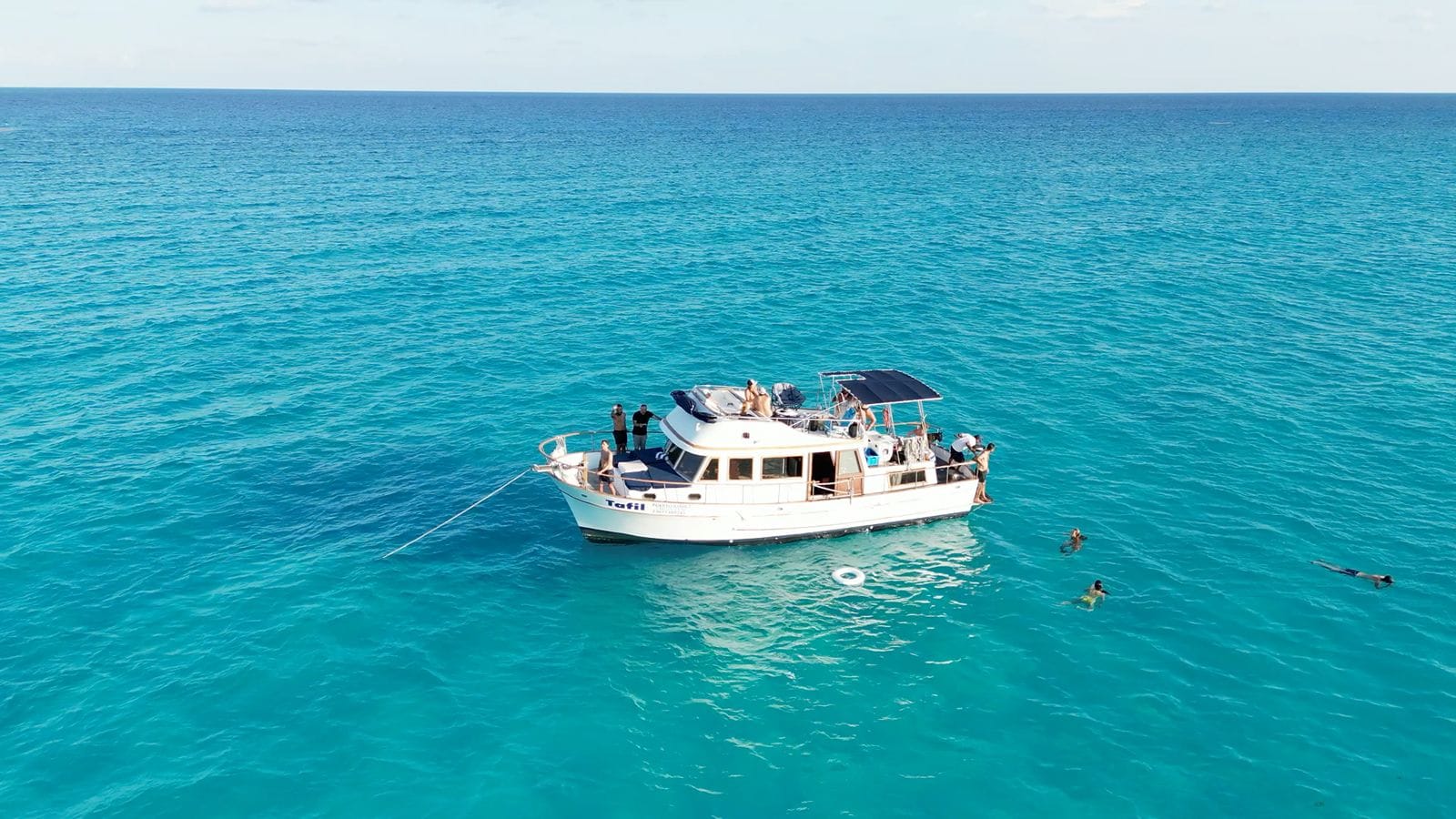 The Tafil at water level in the turquoise Caribbean under a clear sky