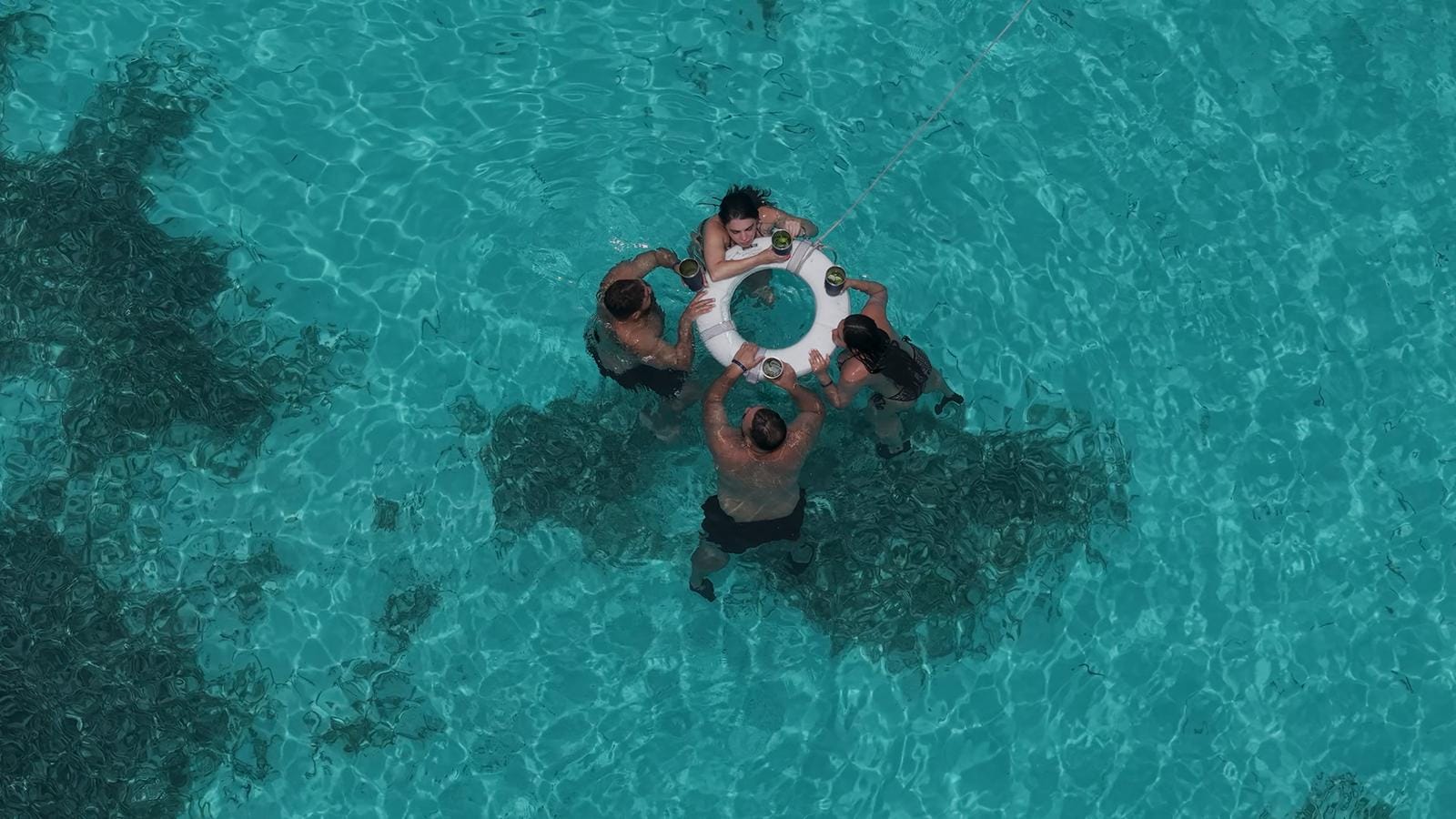Top-down view of a snorkeler in the clear water at Punta Sur